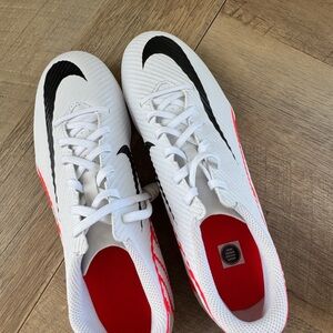 Nike White Soccer Cleats with Black Swoosh and Red Trim
